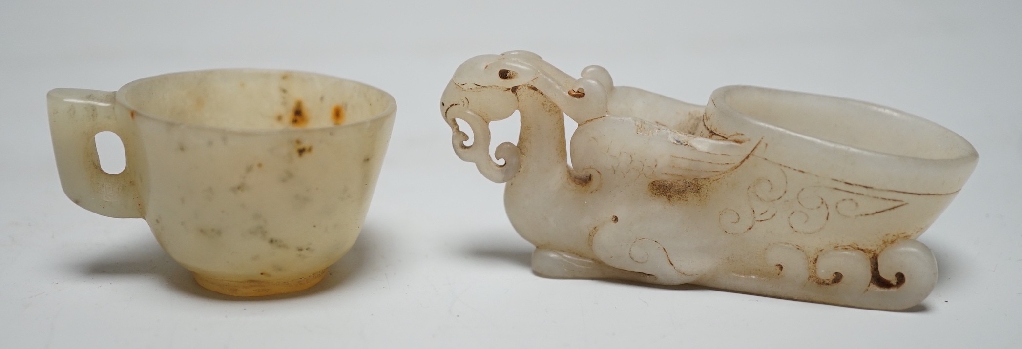 A Chinese hardstone rhyton cup and a bowenite jade cup, largest 9cm